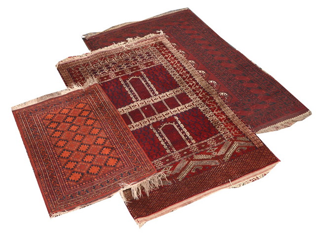 Appraisal: AN AFGHAN RED GROUND RUG with white hooked border m