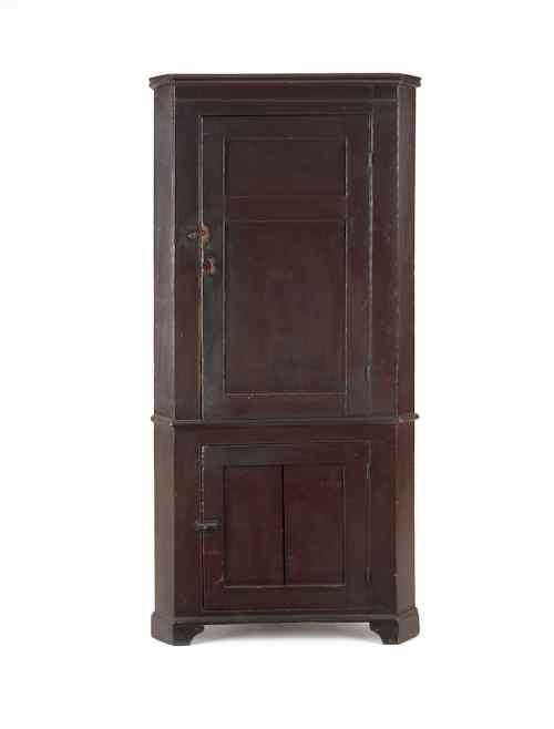 Appraisal: Diminutive Pennsylvania painted one-piece corner cupboard ca retaining an old