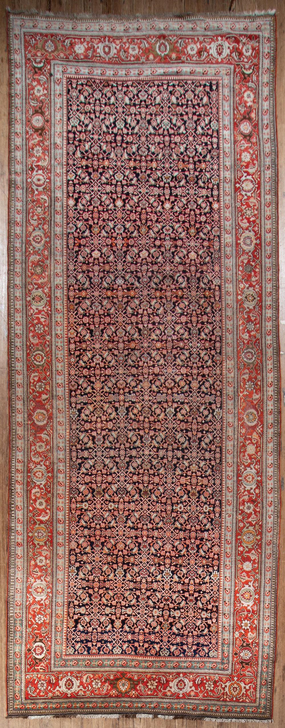 Appraisal: Large Persian Carpet dark blue and salmon ground overall vining