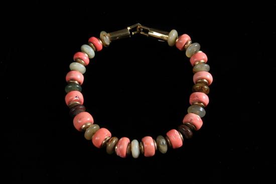 Appraisal: JADE AND PEACH-COLOR CORAL DISK NECKLACE Jade beads alternate with