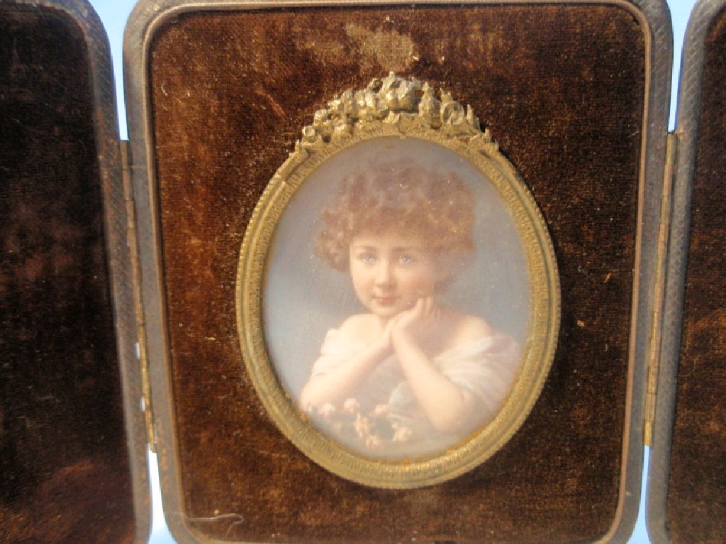 Appraisal: A Victorian leather cased photographic miniature of a child cm