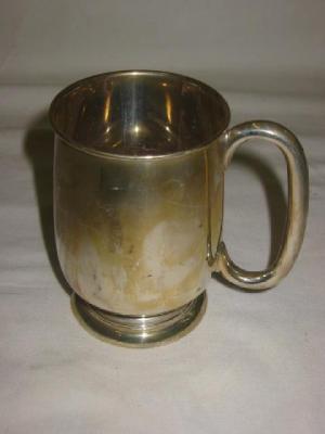 Appraisal: A MUG of mild ovoid form with moulded rim loop