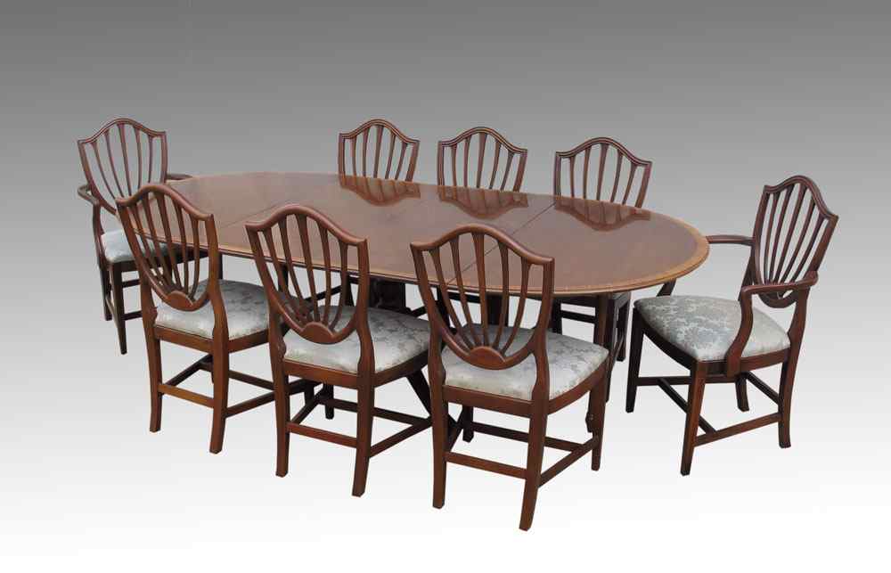 Appraisal: HICKORY CHAIR CO DINING TABLE AND CHAIRS Oval pedestal dining