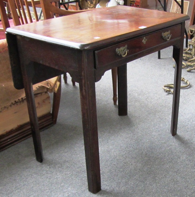 Appraisal: A mid th century mahogany single drop flap supper table