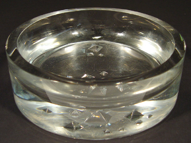 Appraisal: Tapio Wirkkala circular glass ashtray abstractly cut to the base