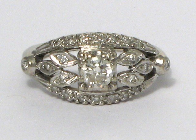 Appraisal: DIAMOND AND FOURTEEN KARAT GOLD RING The white gold setting