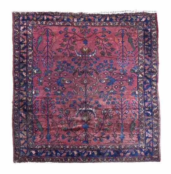 Appraisal: A Sarouk Wool Rug having a foliate design on a