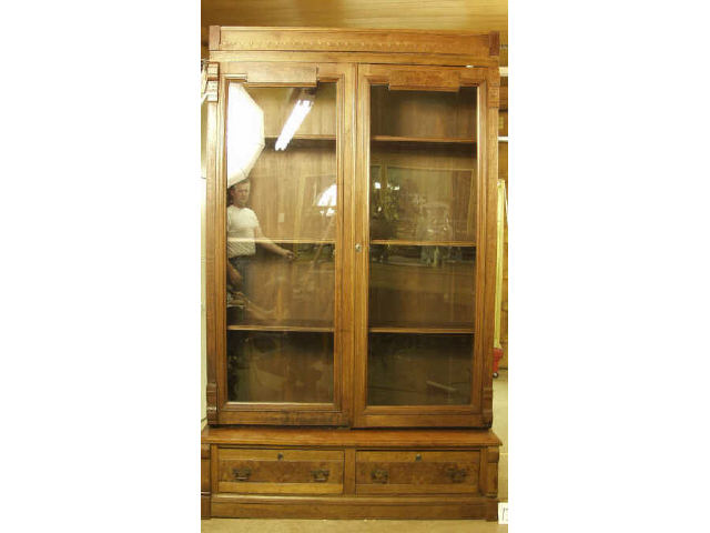 Appraisal: Victorian walnut double door bookcase with three shelves and two