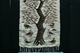 Appraisal: A th Century wool rug depicting trees and birds