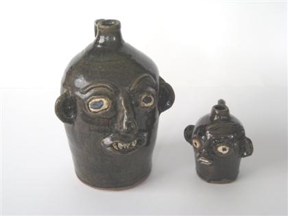 Appraisal: Two glazed redware face jugs Grace Nell Hewell Gillsvile Ga