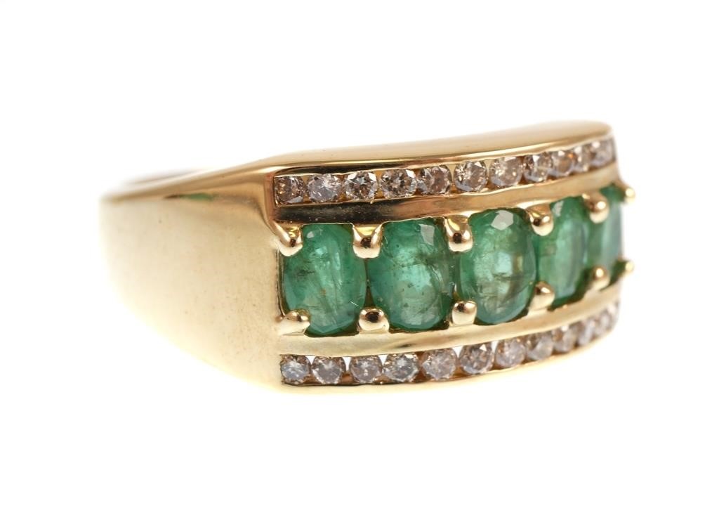 Appraisal: K yellow gold ring contains oval faceted emeralds WEIGHT Ct