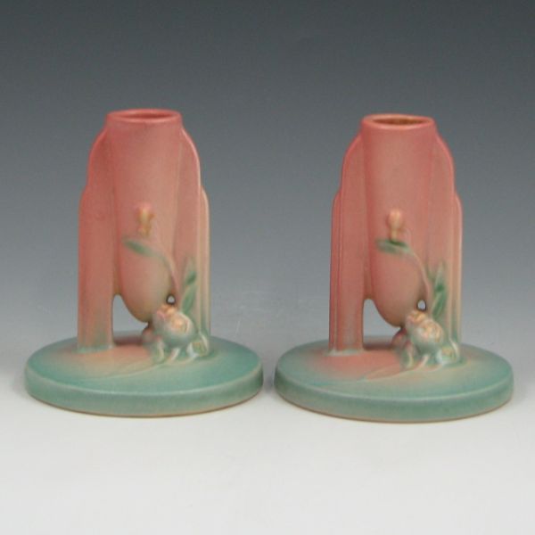 Appraisal: Pair of Roseville Ixia candleholders in pink and light green