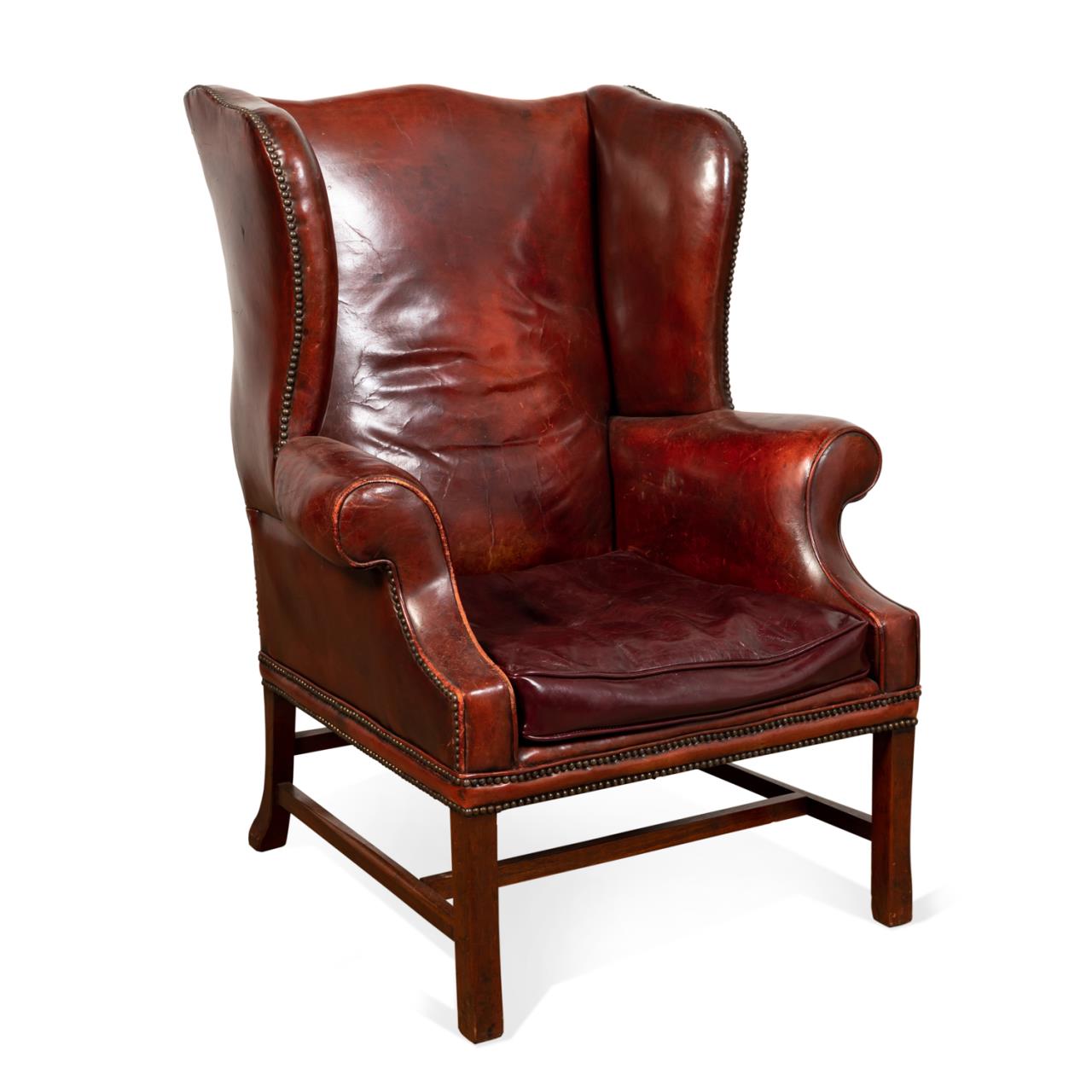 Appraisal: GEORGIAN STYLE BURGUNDY LEATHER WING BACK CHAIR English Chelsea Workshops