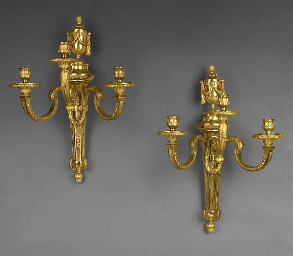 Appraisal: A pair of Louis XVI style gilt bronze three light