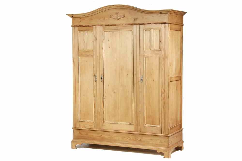 Appraisal: WARDROBE - th c natural waxed pine three door wardrobe