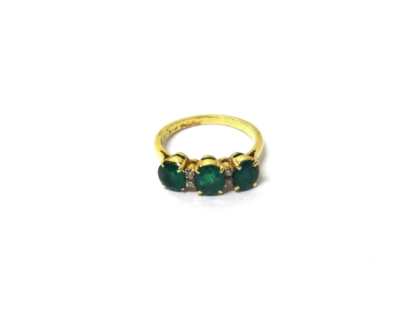 Appraisal: A gold emerald and diamond set ring claw set with