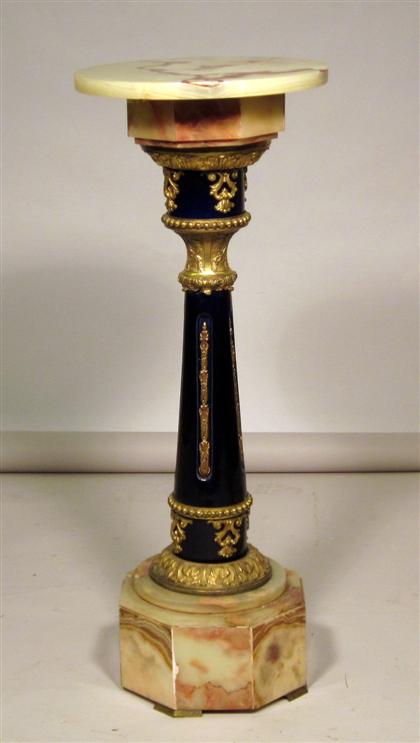 Appraisal: Continental gilt metal mounted onyx and blue ground pedestalThe circular