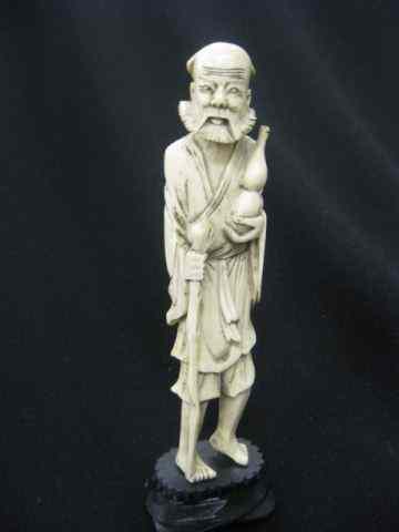 Appraisal: Chinese Carved Ivory Figurine of a Bearded Man holding a