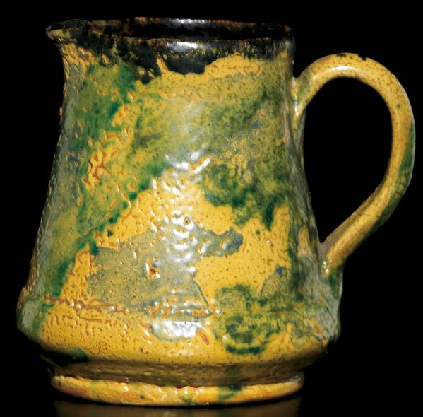 Appraisal: GEORGE OHR Small pitcher covered in an unusual curdled yellow