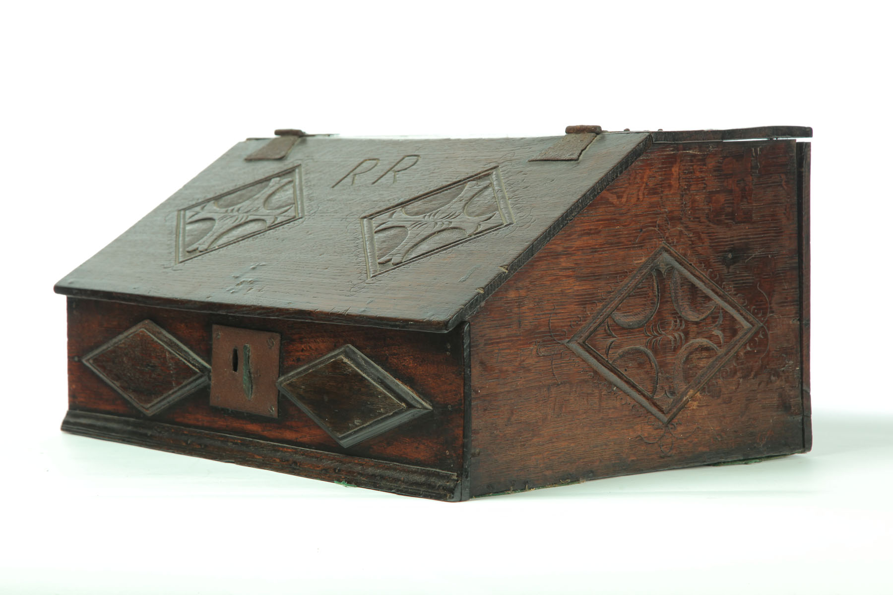 Appraisal: BIBLE BOX England th century oak Slant-front box with iron