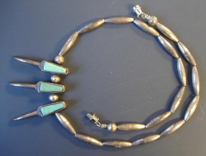 Appraisal: Silver Necklace Unmarked with elongated silver beads and three claw-like