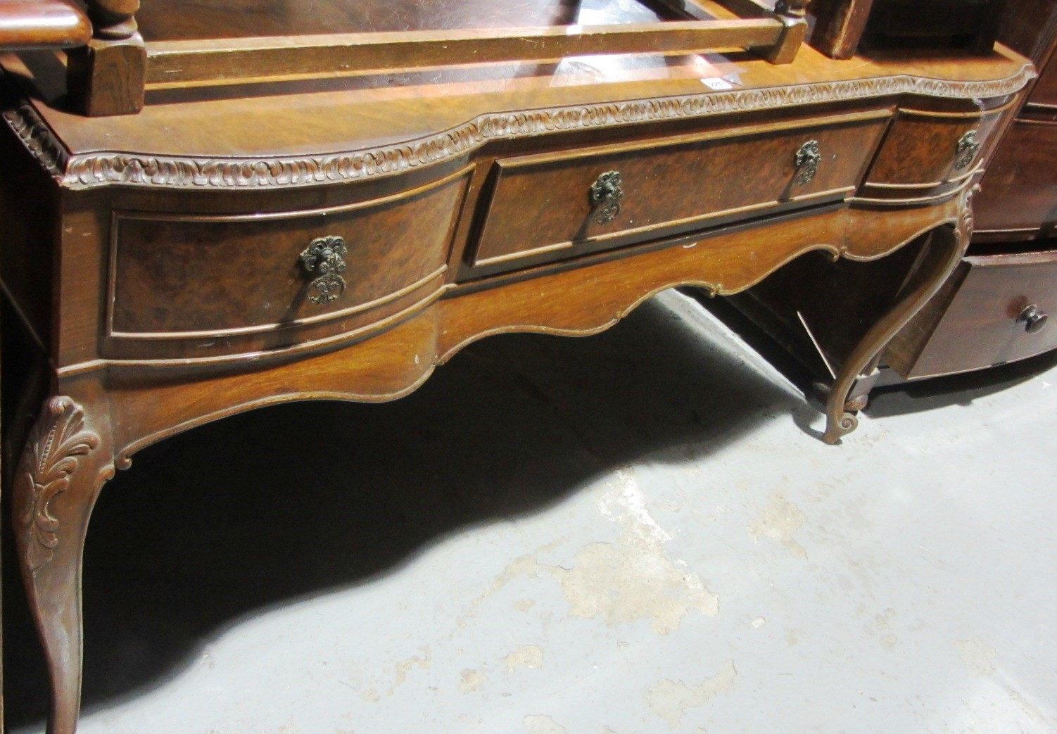 Appraisal: A th century walnut dressing table with a triptych mirrored