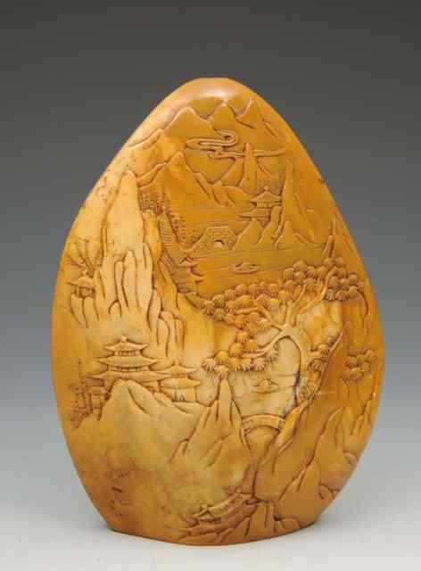 Appraisal: A CHINESE CARVED YELLOW STONE with relief study of temples