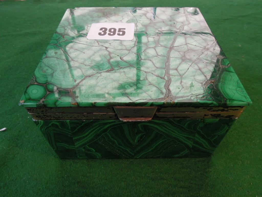 Appraisal: A malachite cigarette box with silver borders and interior London