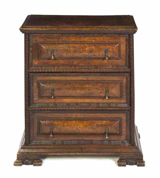 Appraisal: A Continental Walnut Chest of Drawers having a rectangular top