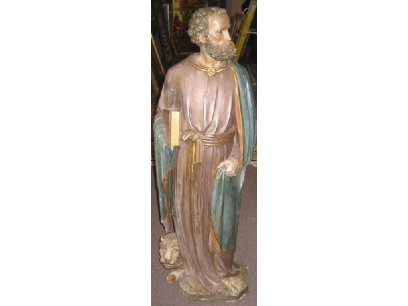 Appraisal: CARVED WOODEN RELIGIOUS FIGURE St Mark holding a book a