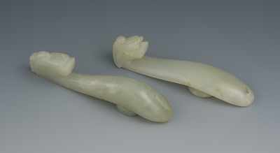 Appraisal: Two Carved Jade Belt Hooks Two belt hooks both having