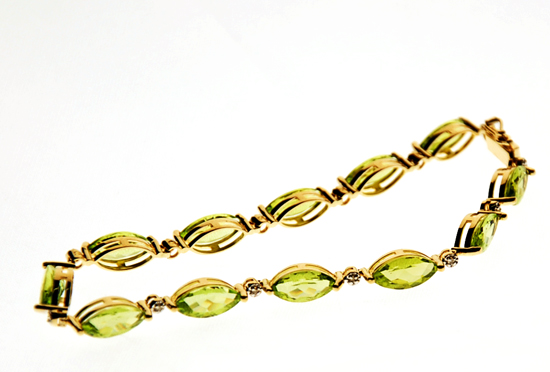 Appraisal: A Gold Peridot and Diamond Bracelet K marked yellow gold