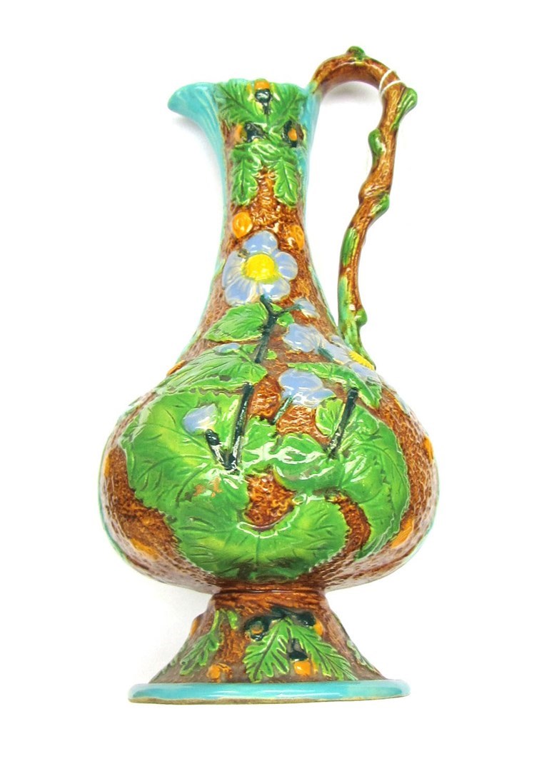 Appraisal: A Minton style majolica ewer moulded with flowers cm high