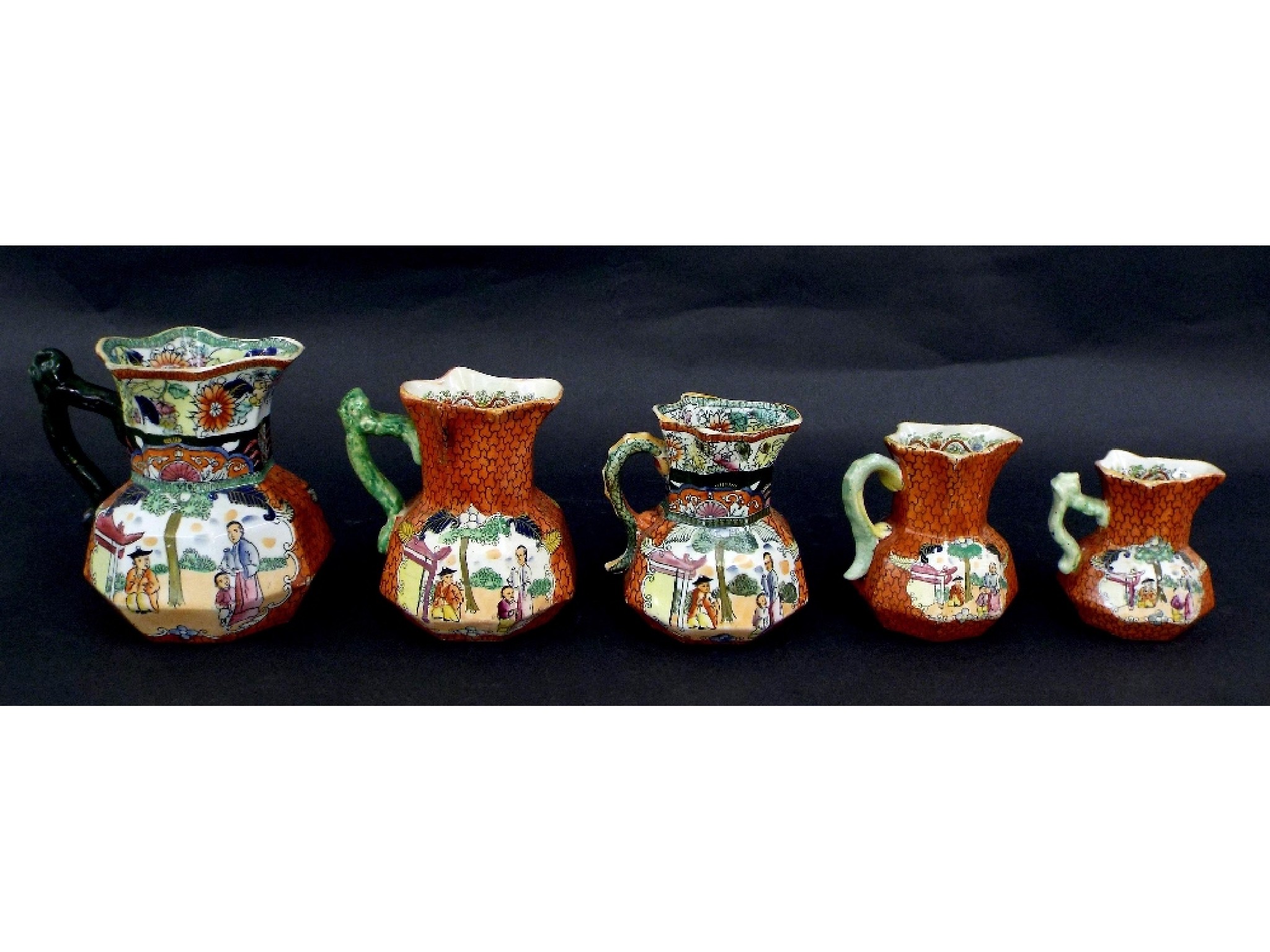 Appraisal: Set of Masons Ironstone 'Red Scale' faceted jugs marked 'Royal