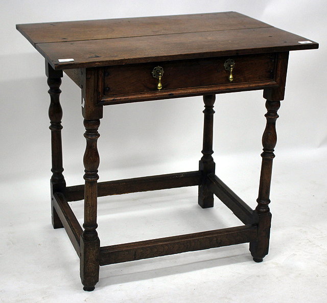 Appraisal: AN ANTIQUE OAK SIDE TABLE the frieze drawer with brass