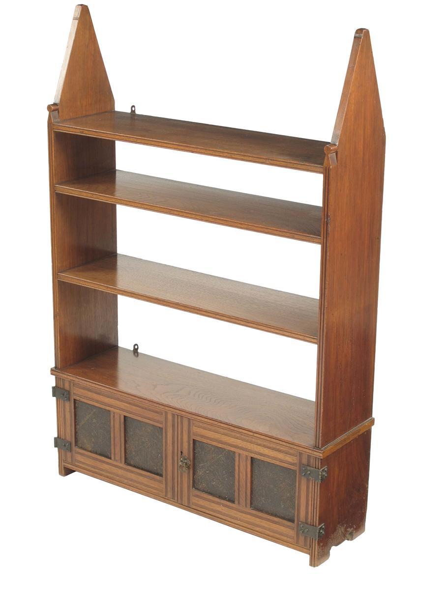 Appraisal: A late Victorian walnut open bookcase