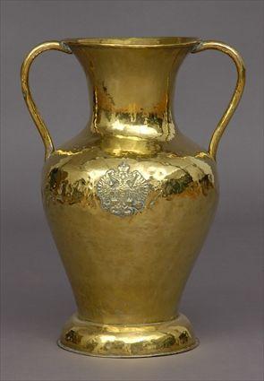 Appraisal: RUSSIAN BRASS DOUBLE-HANDLED URN Together with a group of walking