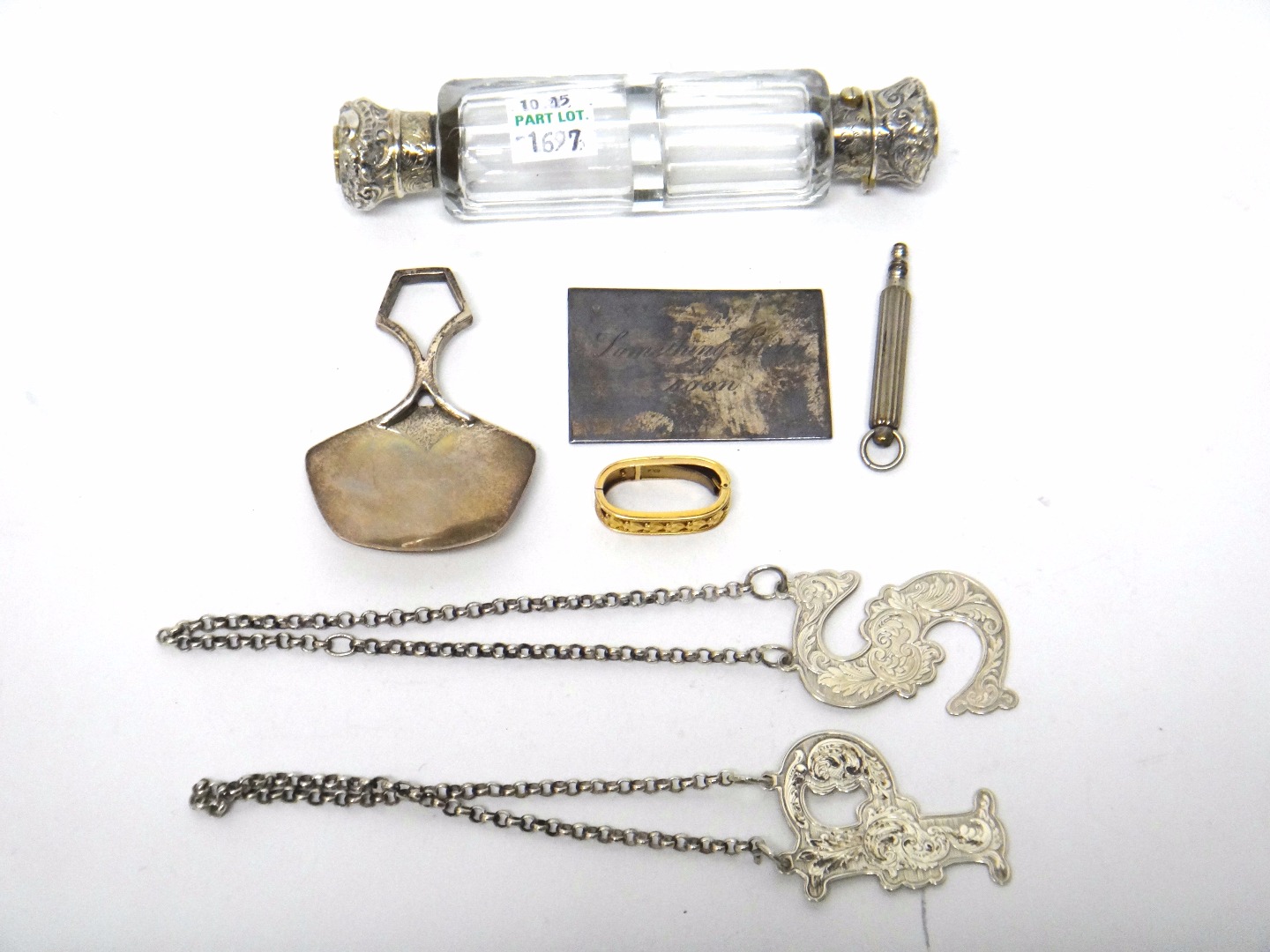 Appraisal: A Victorian silver mounted faceted glass double ended scent cum