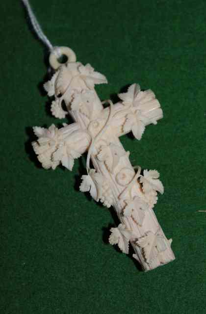 Appraisal: A VICTORIAN CARVED IVORY CROSS with entwined fruiting vine decoration