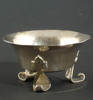 Appraisal: An A E Jones silver salt waisted form on three