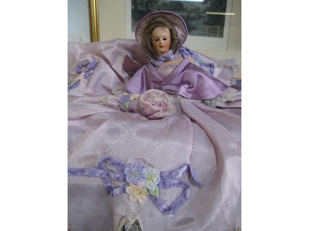 Appraisal: Lot comprising half doll and a pyjama case