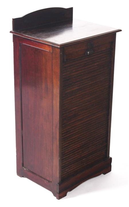 Appraisal: An early th century oak filing cabinet with arched gallery