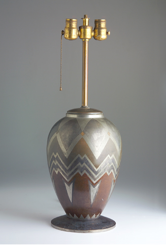 Appraisal: JEAN VERSCHNEIDER Patinated metal lamp base with geometric design Some