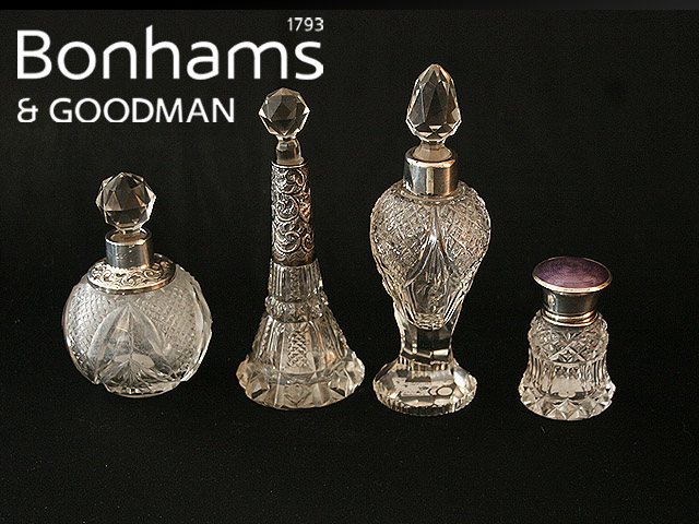 Appraisal: Four silver mounted cut glass scent bottles and stoppers of