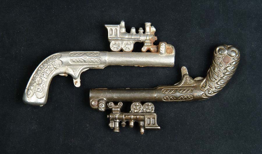 Appraisal: PAIR OF TWO ANIMATED CAP PISTOLS Locomotive by Kenton AN