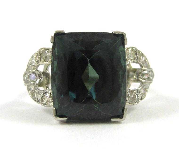 Appraisal: GREEN TOURMALINE DIAMOND AND PLATINUM RING with seven round-cut diamonds