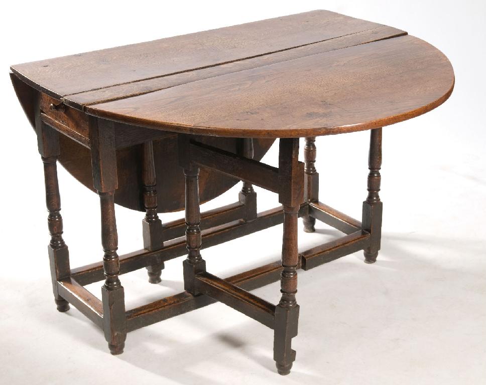 Appraisal: th CENTURY OAK GATELEG DINING TABLE the oval top over