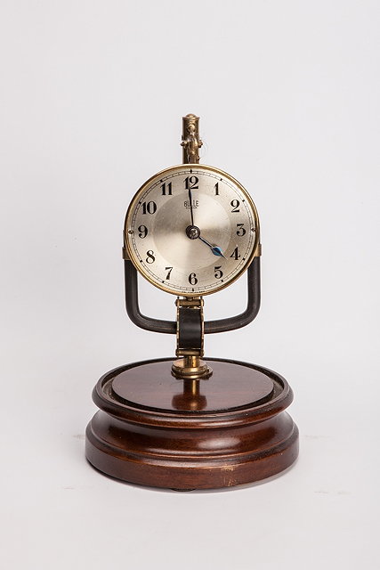 Appraisal: A BULLE ELECTRIC CLOCK on turned circular base and under