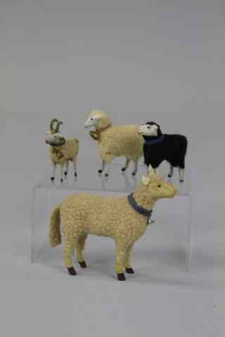 Appraisal: SMALL SPOTTED RAM AND THREE WOOLLY SHEEP Includes small spotted