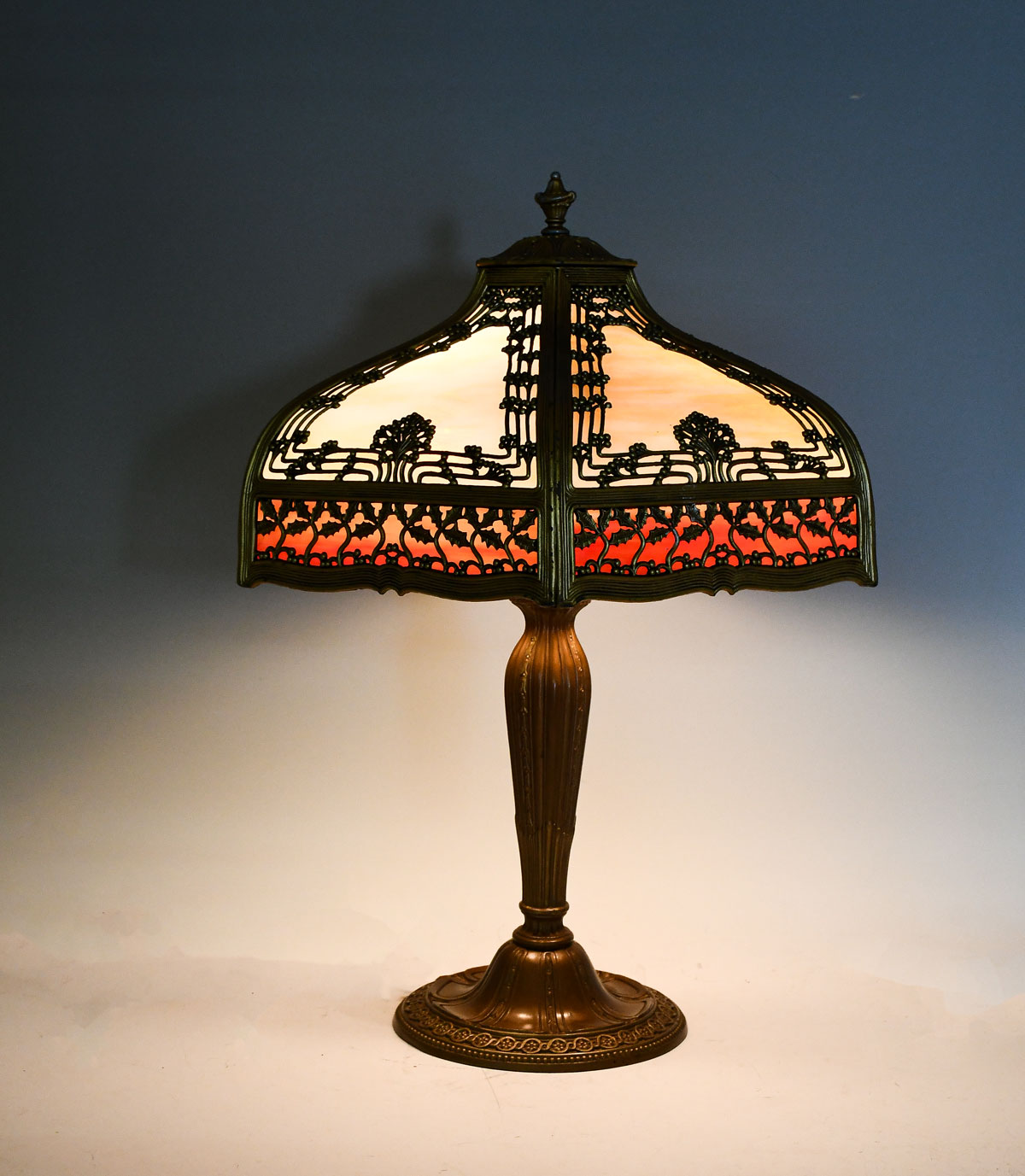 Appraisal: STAINED GLASS BENT PANEL FILIGREE LAMP Hexagonal bent panel slag